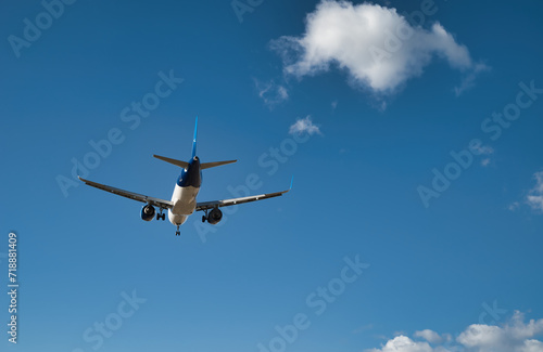 Passenger airplane, flying in the blue sky