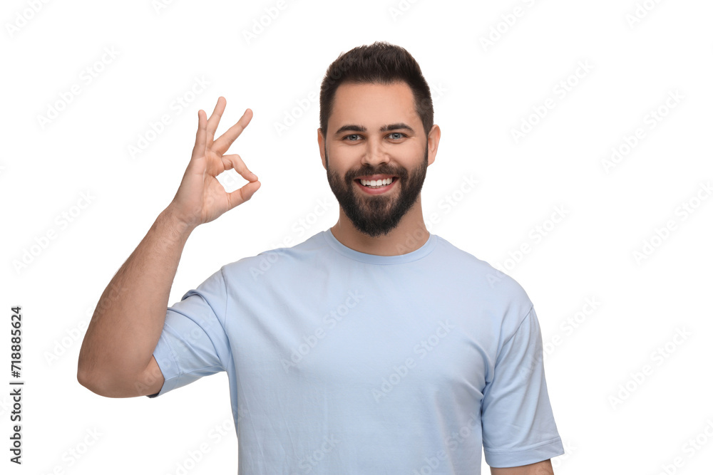 Man with clean teeth showing OK gesture on white background Man with clean teeth showing OK gesture on white background