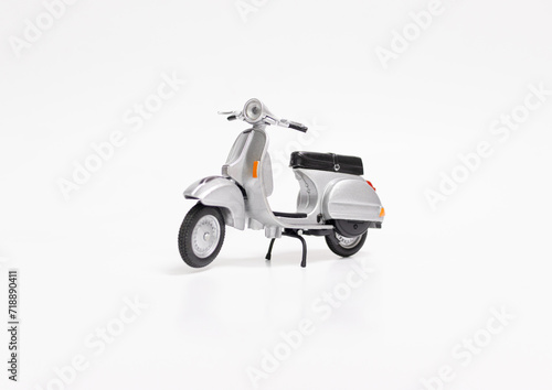 Miniature classic scooter on white background. After some edits.