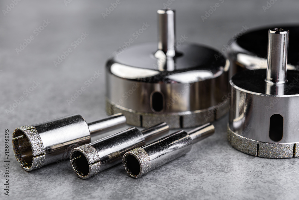 Diamond core drills for tiles on gray background. Diamond core drills for tiles on gray background.