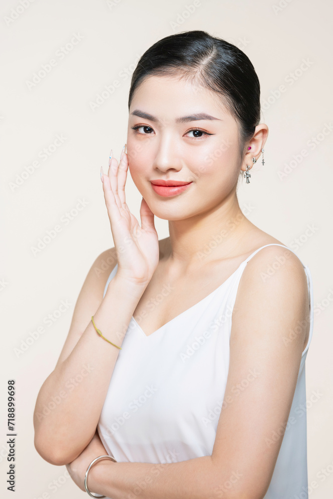 Beauty portrait of asian smiling laughing woman clean fresh face isolated on white background Beauty portrait of asian smiling laughing woman clean fresh face isolated on white background