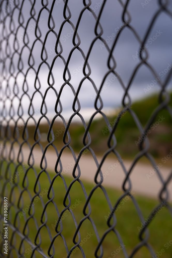 Fototapeta premium Barbed wire fence on the sunset black and white photography