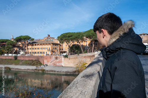 Person Overlooking Scenic View of Buildings and River