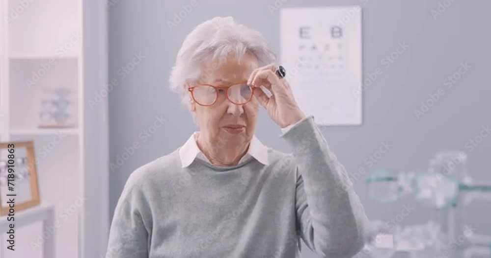 Senior woman choosing new glasses Senior woman choosing new glasses