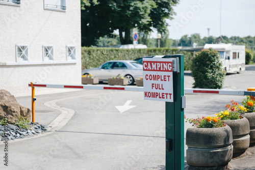 A Camping is Full signage with a closed barrier, located in Thionville near the Luxembourg border, signaling no availability for campers photo