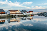 scenic reflection of typical wooden houses in the harbor of Svolvaer,Norway