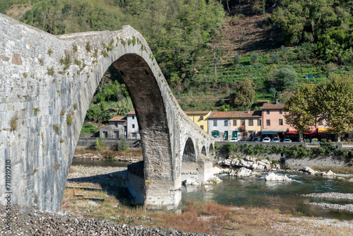 Ancient stone bridge, the medieval Ponte Maddalena, or Devils Bridge, in Tuscany