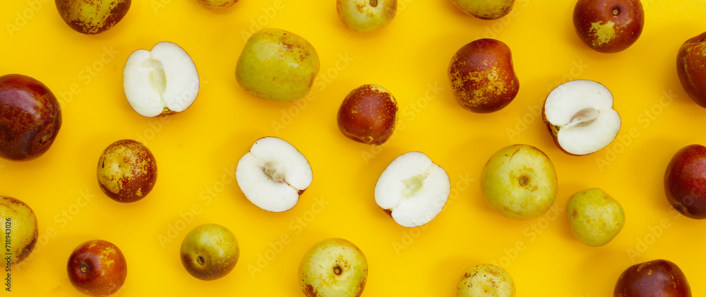 Fresh jujube fruit on yellow background Fresh jujube fruit on yellow background