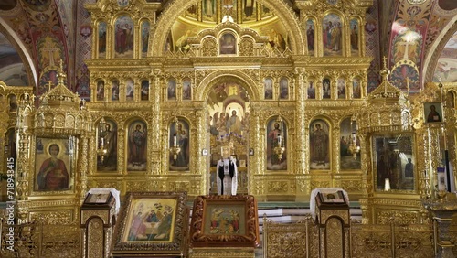 Ornate golden iconostasis with religious paintings in an Eastern Orthodox Church, exuding rich spiritual and cultural heritage.