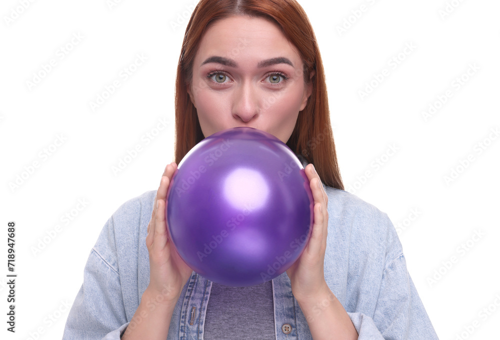 Woman inflating purple balloon on white background Woman inflating purple balloon on white background