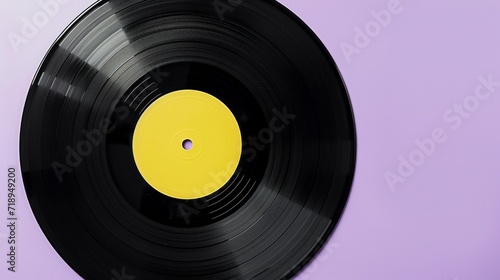 Black Vinyl Record on purple background. Image of a Long Play. Sound tracks on a vinyl record