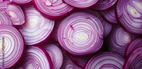 A close up of many onion slices. The onions are cut in half and arranged in a pattern
 photo
