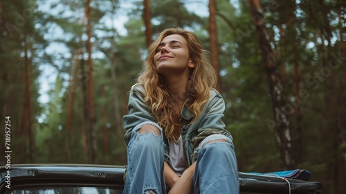 Closed-eyes young woman enjoying the camp in the woods as perched on a car top, space, Generative AI.