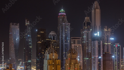 Skyscrapers of Dubai Marina near Sheikh Zayed Road with highest residential buildings all night timelapse © neiezhmakov