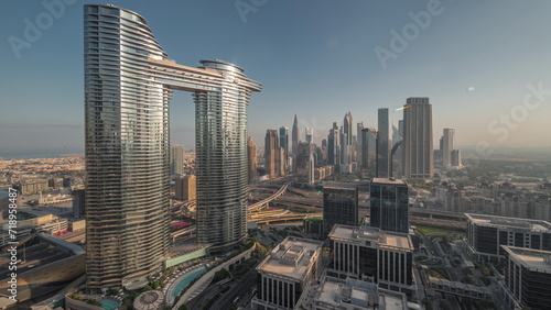 Futuristic Dubai Downtown and financial district skyline aerial night to day timelapse.