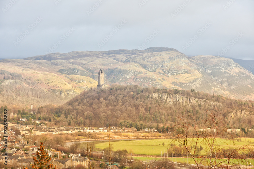 Panoramic view of historic National Wallace Monument against Ochil Hills, Scotland