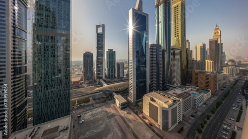 Aerial view of Dubai International Financial District with many skyscrapers timelapse.