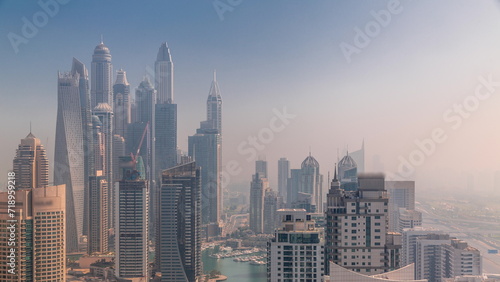 View of various skyscrapers in tallest residential block in Dubai Marina aerial timelapse © neiezhmakov