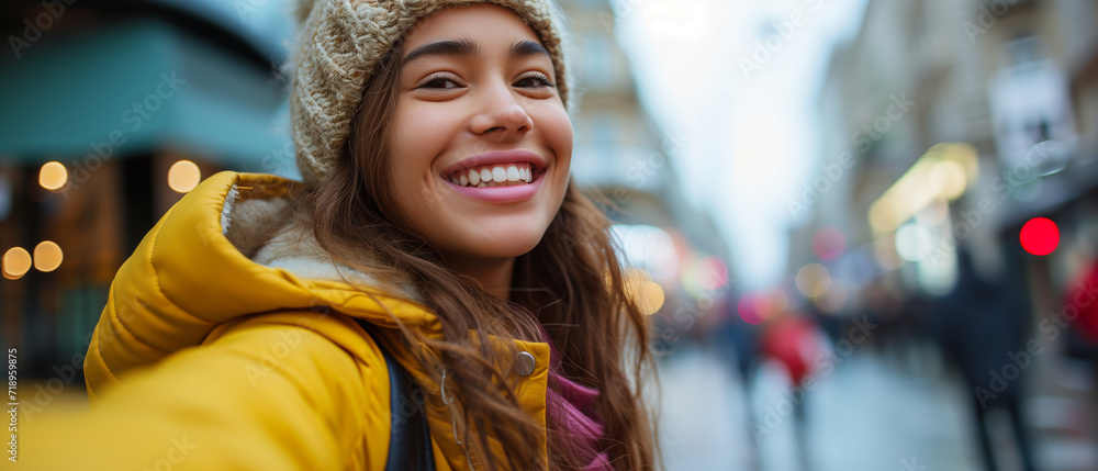 Radiant Young Woman Enjoying Winter Shopping: A Candid Street Portrait in a Vibrant Urban Setting