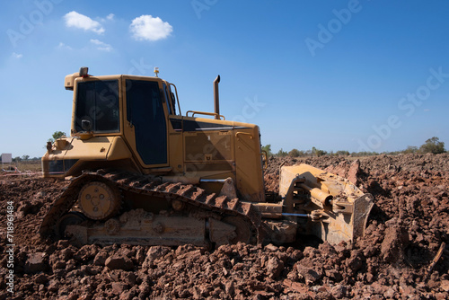 Wallpaper Mural Dozer is pushing dirt. Bulldozer is working  gravel surface for new road. Torontodigital.ca