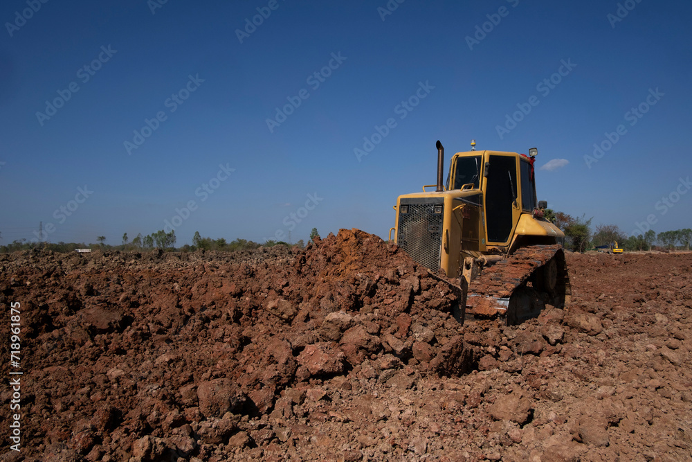 Dozer is pushing dirt. Bulldozer is working gravel surface for new road. Dozer is pushing dirt. Bulldozer is working gravel surface for new road.