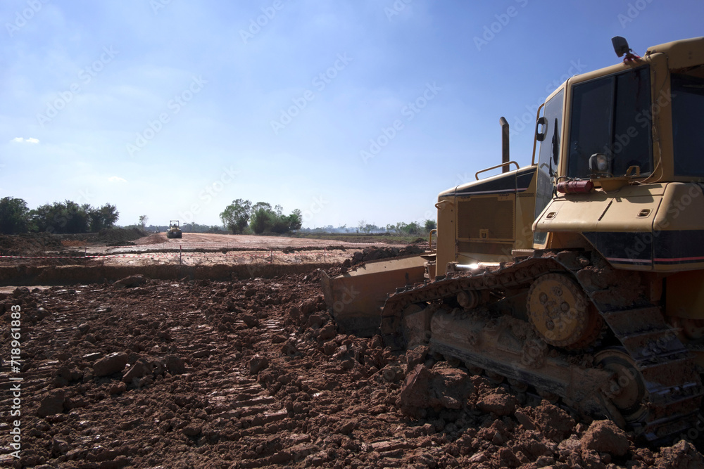 Dozer is pushing dirt. Bulldozer is working gravel surface for new road. Dozer is pushing dirt. Bulldozer is working gravel surface for new road.