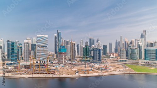 Cityscape with skyscrapers of Dubai Business Bay and water canal aerial timelapse. © neiezhmakov