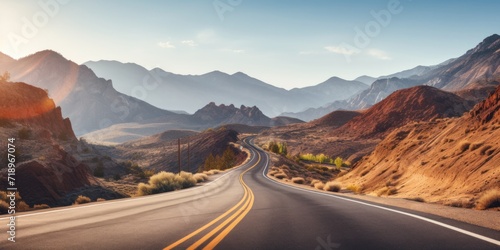 The highway winds through breathtaking mountains, revealing a stunning natural landscape. photo