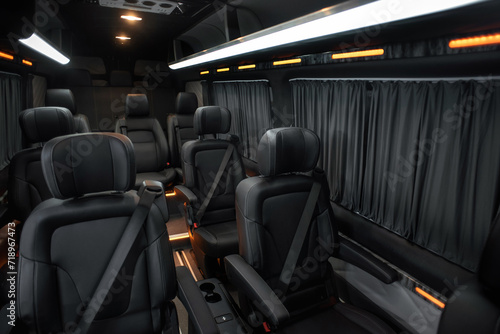 Comfortable interior of a passenger bus with soft seats. The design is made to order. Private covering of cars. Various elements of the bus interior.