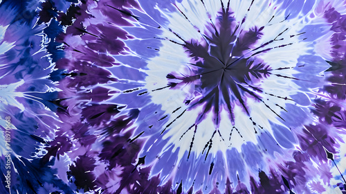A vibrant tie-dye pattern with shades of purple and blue radiating from the center in a burst-like effect