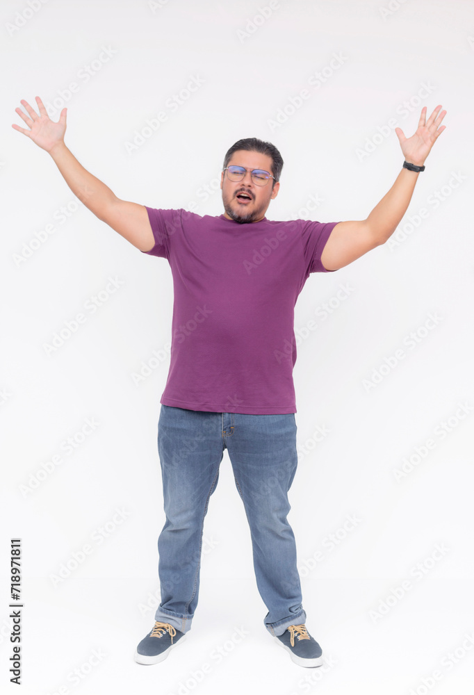 Happy fervent man with glasses raising his arms in victory against a white background, expressing joy and success. Happy fervent man with glasses raising his arms in victory against a white background, expressing joy and success.
