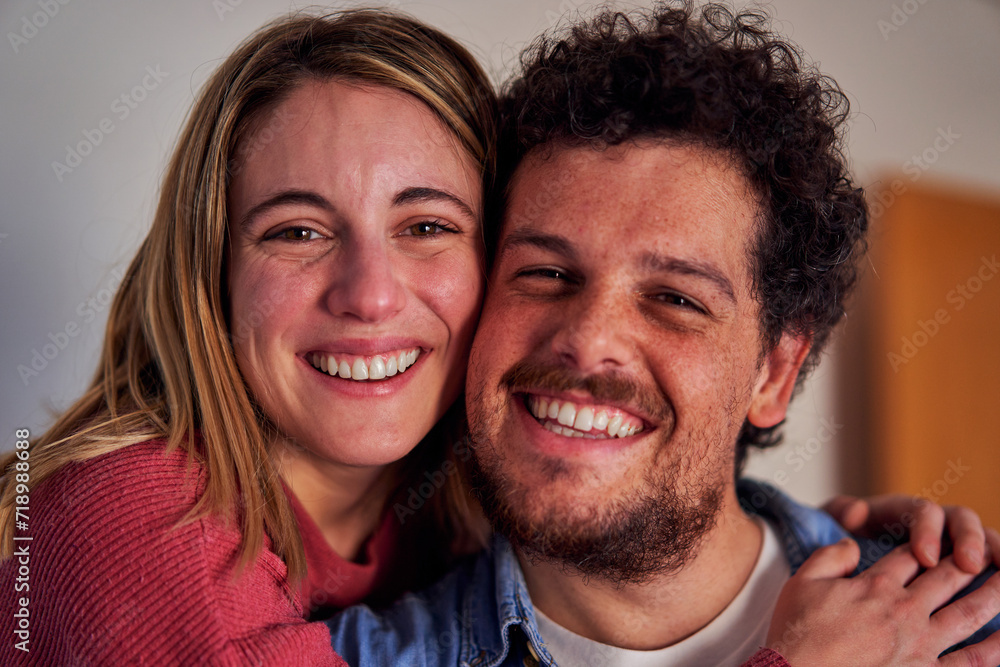 Headshot of a Cheerful caucasian couple at home looking at camera smiling. Close up. Headshot of a Cheerful caucasian couple at home looking at camera smiling. Close up.