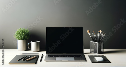 A neatly organized home office desk with a laptop, plant, and stationery, embodying a clean and modern work environment. photo
