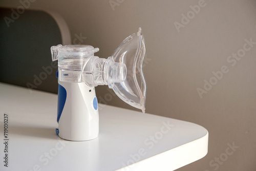 Oxygen mask of nebulizer with steam, medical equipment for pneumonia, covid, sars and bronchitis treatment. Inhaler, respiratory pulmonary disease, child allergy