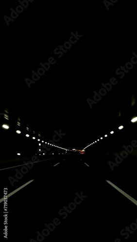 Driving through a highway tunnel at night