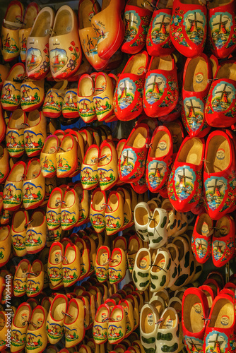 Dutch wooden shoes or wooden clogs, famous symbol of Netherlands, hanged in the shop