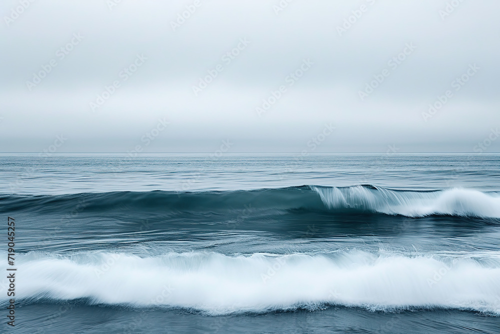 the tranquility and stillness of a vast ocean while hinting at the potential energy stored within the waves.