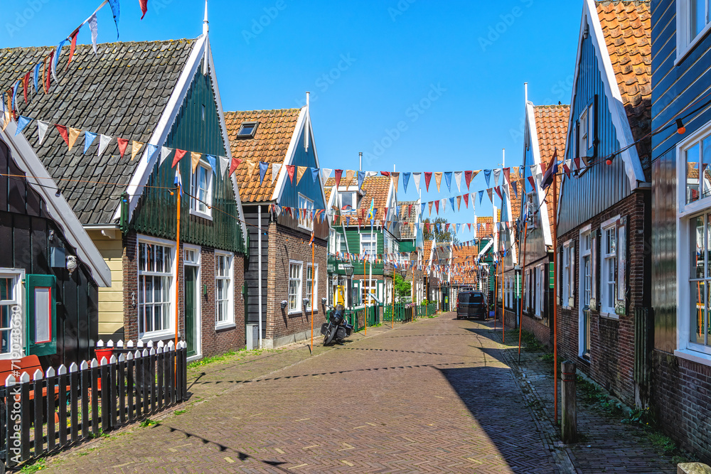 Flag filled street in the historic fishing village of Marken.