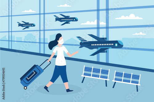 Business woman traveller wearing face mask with luggage walking at empty airport gate terminal lounge traveling during pandemic outbreak.