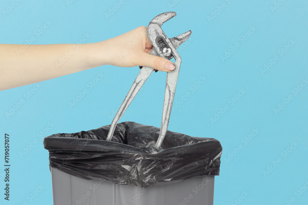 throw the adjustable gas wrench into the trash bin, pipe wrench in hand