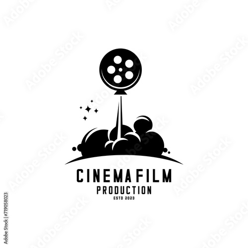 film reel logo sliding like a rocker taking off releasing smoke, cinema and movie logo