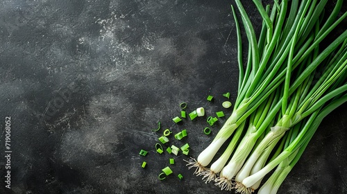 Top view of fresh green onion with a big copy space on black surface, Generative AI.