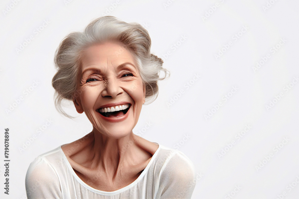 Portrait of an elderly woman laughing, isolated on a white background