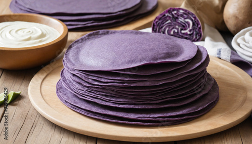 Purple sweet potato tortillas, delicious ube halaya - stack of purple sweet potato tortillas, intelligent technology. photo