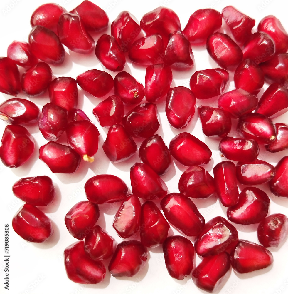 pomegranate seeds - anar dana on white background. pomegranate seeds - anar dana on white background.