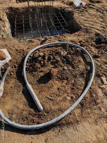 Concrete vibrator on the ground in a construction site. Concrete vibrator for compacting concrete of stiff consistency.