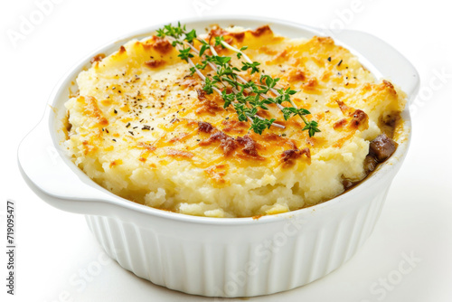 A Sheperd's pie, artfully arranged and isolated on a white backdrop