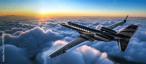 Black luxury business jet flying above clouds in dramatic sunset light. A jet defying gravity, painting skies ablaze with fiery hues.
