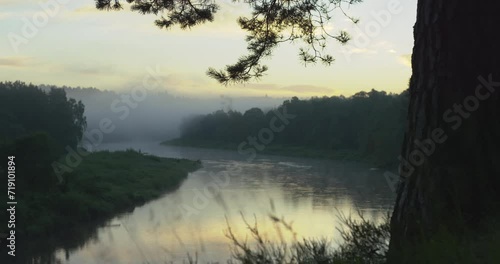 Reveal of a big river bend at dusk. Tracking shot.