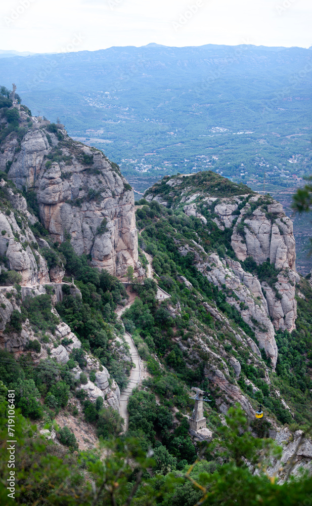 Fototapeta premium Catalonia, Montserrat Monastery, Benedictine monastery, spiritual symbol, religious center of Catalonia, pilgrimage, Catholic, towers, temple, church, religion, art